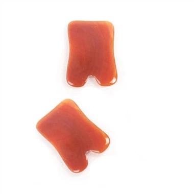 Röd Gua Sha ansiktsmassage
